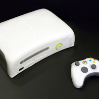 Xbox 360 Groom's Cake Xbox 360 Groom's cake, life-sized, covered in Fondx. Controller is fondant, melted jolly ranchers for buttons on both.