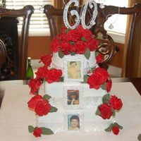 60Th Birthday This is a 60th Birthday cake for a friend. The pictures are edible. The roses are fondant. I was having a hard time with the gumpaste this...