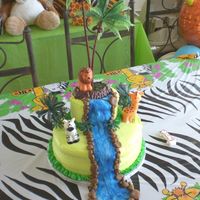 Alejandro's 1St Jungle Birthday This is my 1st cake ever for my son's 1st Birthay. Lime green buttercream icing with fondant waterfall and rocks. Water has eddible...