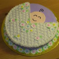 Baby Carriage Baby carriage from Wilton level 2 class book. Buttercream with royal icing daisies (cake sparkles in the centers) and color flow face. The...