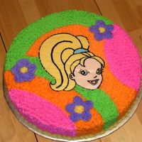 Polly Pocket 12 inch round. Frozen buttercream transfer of Polly's Face. Tip 16 stars for the rest of the cake. The flowers are a little raised...
