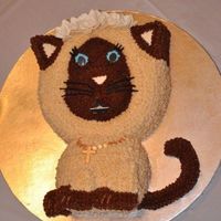 First Communion Kitty Cat This was my daughter's cake for her First Communion. It is a Himalayan cat, wearing a tiara of white flowers (like hers) eating a...