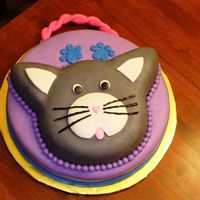 Kitty Cat Purse Cat was made using the Animal Crackers pan from Wilton. The base was a 14 in round. Handle was made with gumpaste, cake covered in...