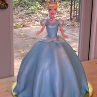 Cinderella Used wonder mold and extra 9 in. round at the bottom. Real Cinderella doll. Covered in MMF. Top of the dress has cake sparkles, and skirt...