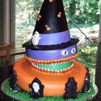 3 Halloween Vignettes Topsy-turvy cake with 3 vignettes: a cemetery at the bottom with chocolate tombstones, a witch's hat on the top (made with Rice...