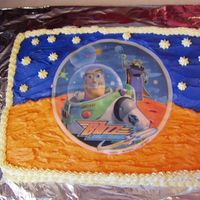 Buzz Lightyear Edible Image Cake I got the idea from a few posters here and used the orange and blue icing to make it look like there was no image. It was my first time...