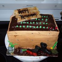 Gardeners Cake Everything on this cake is edible.It was alot of fun to make especially the gumboots. There is a mix of fondant,marzipan and gumpaste used...