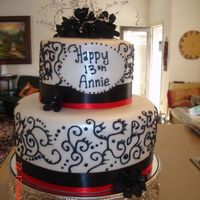 Black & White This cake was a 6" & 10" stacked fondant with dark chocolate cake & chocolate ganache. I brushed it with pearl luster and...