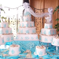 Seashells And Coral This is the biggest cake I've done so far. There were 14 cakes plus a groom's cake! The coral is made of royal icing and the...