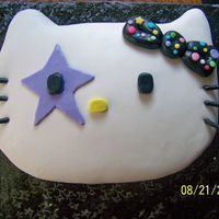 Hello Kitty Rock N Roll this turned out to be a huge Hello Kitty head! I forgot my other one was only 1 layer/ 1/2 sheet of cake! Soo I had to layers ( 2 Half...