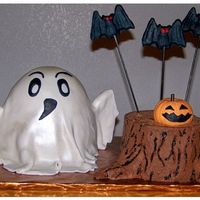 Ghost And Stump Two seperate cakes for a Halloween Birthday. Ghost is Red Velvet covered in fondant. Stump is german chocolate cake with coconut filling...
