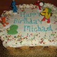 Seasame Street Cupcake Cake Vanilla Cupcakes iced in buttercream, and decorated with seasame stret figures.