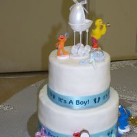 Lauren's Babyshower I did a two tier fondant cake for my sister's bayshower. I used white cake with fresh strawberries and buttercream icing.