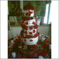 Rose_Cake.jpg This is a four tier cake I did for my mother's wedding. I just finished taking a fondant and gumpaste class. It is a buttercream cake...