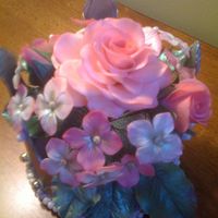 Crown And Flowers this is the back view of a silver crown filled with flowers I did for a friend to use as a topper for her 6 year old daughter's...