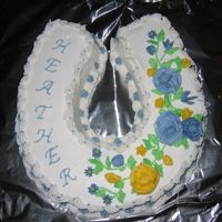 Heather's Birthday Cake This is a white cake with white Buttercream icining. This is only the 3rd cake I have made since I have been taking Wilton Course I. I keep...