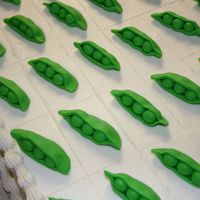 Pea Pod Sheet Cake I made two 1/2 sheet cakes for a seed company party. Each scored piece had a fondant pea. They loved it.
