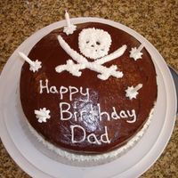 Pirate Themed Birthday Cake I made this cake for my father-in-law's birthday. We were taking him to a pirate dinner show so this cake worked well.