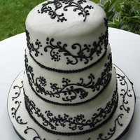 Lacy's Wedding Cake This is marshmallow fondant including what is on the cake board. The black is regular buttercream. The marshmallow fondant was easy to make...