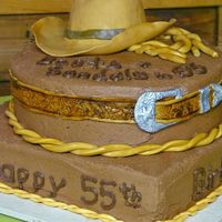 Western Cake I made this cake for our square dance club's birthday. The hat, belt, buckle and rope are fondant. My goalwas to get the hat and belt...