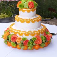 Closer_View.jpg the bride wanted oranges, green grapes, orange roses-the florist helped up decorate-there are also limes-her colors were bright orange and...