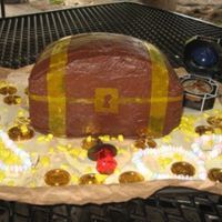 Treasure Chest Cake This is the cake that started my fascination with cake making a year ago! Pirates themed birthday party. Yellow cake, carved to be somewhat...