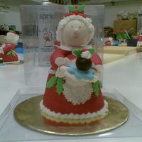 Mrs Claus Mrs Claus made out of mini bell shaped fruit cake and lots of fondant. Fun class to do.