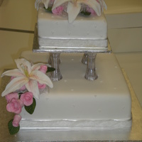 White Wedding Cake made in class. first large flowers, first wedding cake, first tiered cake.
