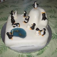 Penguin Party Girls penguin birthday party cake. There is one penguin for each guest, about 2.5 in. each, cake is about 15" x 15" MMF cake and...