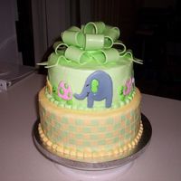 Teresa's Baby I designed this cake to match the shower invitation. I enlarged the animals and then piped them in Color Flow. All other accents are...