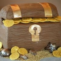 Treasure Chest I made this for a friends son's bday. His sister got the Belle cake. The chest is iced in buttercream with fondant accents. The coins...