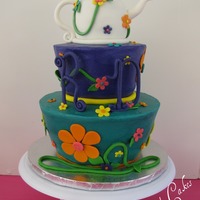 A Tea Party This cake was for my daughter's 10th birthday. It had cake disaster written all over it & then I did drop the purple tier, LOL! I...