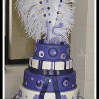 Lisa This is the largest cake I've done to date. Buttercream w/fondant accents....Feathers are real.