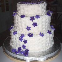 Dcp_0016.jpg My very first wedding cake. It's a buttercream basketweave with violets. It's not perfect but I was thrilled how it turned.