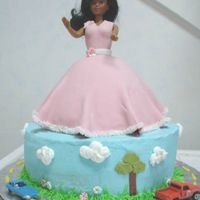 Boy Car Cake And Girl Barbie Cake I was asked to do a cake for dual birthday party. The boy likes cars and the girl likes Barbie. This is what I came up with. It was a hit....