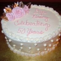 Anniversary Cake This was a small oval cake made for a friend at work who gave it to her parents on their anniversary. It was a chocolate layer cake with...