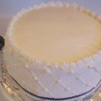 Practise Wedding Tier Just a practise wedding cake tier. Buttercream with hand made fondant beads. Trying to figure out the criss cross pattern