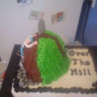 Over The Hill First OTH cake for a friend. Buttercream frosting over chocolate hill and vanilla base. Fondant man (forgot to take out toothpicks before I...