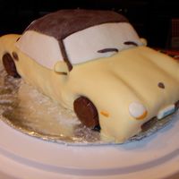 Porsche Boxster I made this cake for my fiance's birthday. It looks like his car. It's MMF with chocolate clay wheels and top. He totally loved...