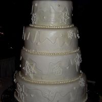 Winter Wedding Cake This cake I recently made for my sister-in-law's winter themed wedding. It's covered in MMF, with an extra layer over the tops...