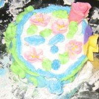 My Niece's First Decorated Cake My 9 year old niece decorated this. She used some of my flowers