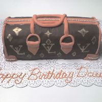 My Sister's Birthday Cake My sister loves LV. But when she finally moved down here she couldn't find one that she liked so I baked her one for her birthday.