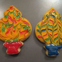 Ornaments These are no fail sugar cookies iced with antonia's royal icicng and then I used drops of Wiltons sparkle gel and swirled it with a...