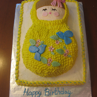 Matryoshka Doll Cake This is a buttercream cake with fondant accents. It was for a little girl's first birthday party in the them of Ukranian Princess.