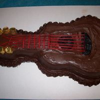 Guitar Cake not great, but I used pull-n-peel licorice for the strings, pretty easy