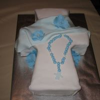 First Communion Chocolate cake with MMF. Gumpaste cross, flowers and rosary beads.