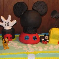 Mickey Mouse Clubhouse fondant covered cake. ball pan used for the head. Rice cereal hands and ears.