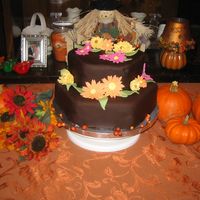 Rehearsal Dinner Chocolate cake covered in dark chocolate fondant. Gumpaste flowers.