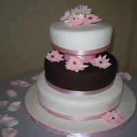 Wedding Cake My first wedding cake. White and Dark Choclate fondant. Gumpaste flowers