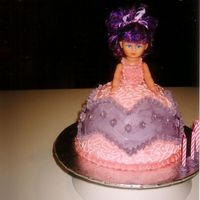 Dolly Vardin Vanilla cake, covered in buttercream, piped flowers. and cornelli work.